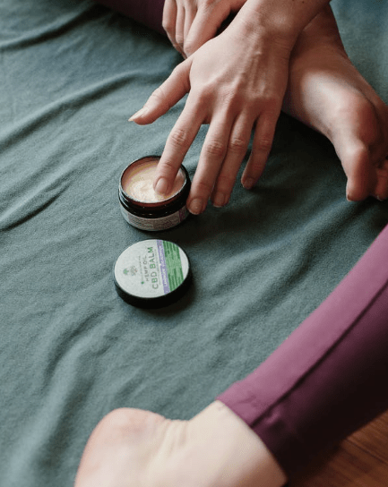 person-s-hand-in-a-wax-container