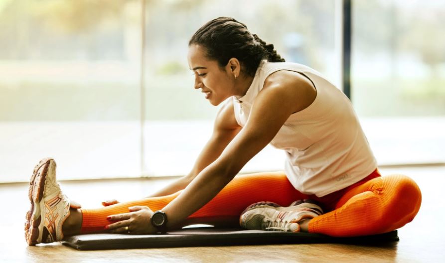 a woman stretching on the floor