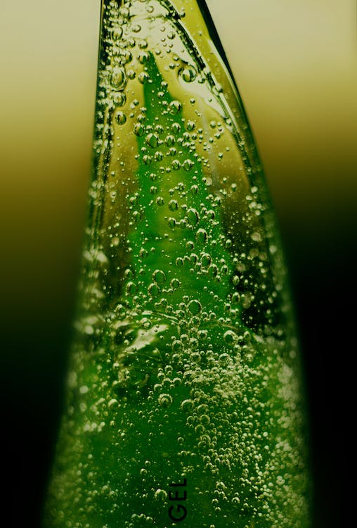 Macro Photography of Aloe Vera Gel on a Plastic Container