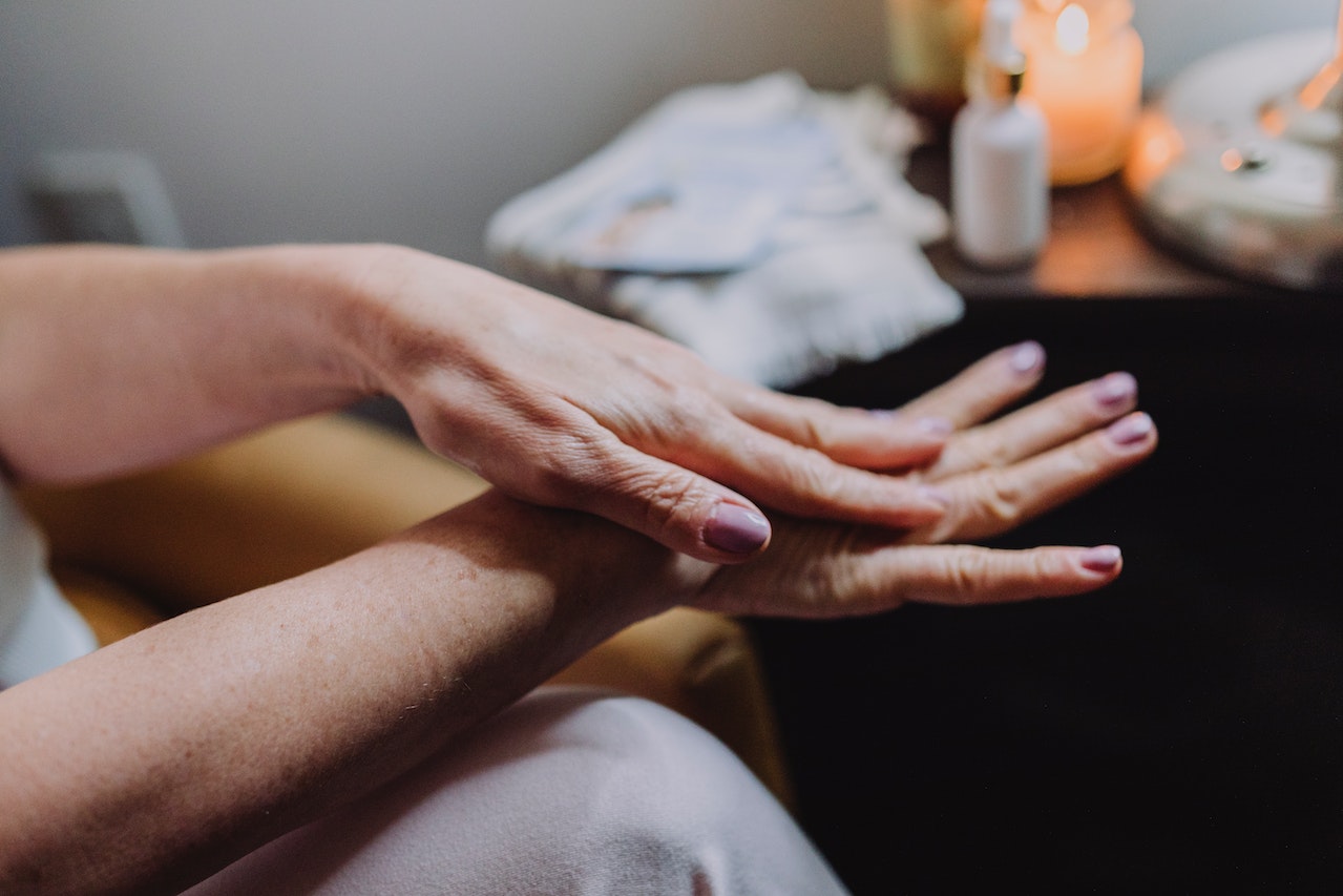 persons hand with manicured nails