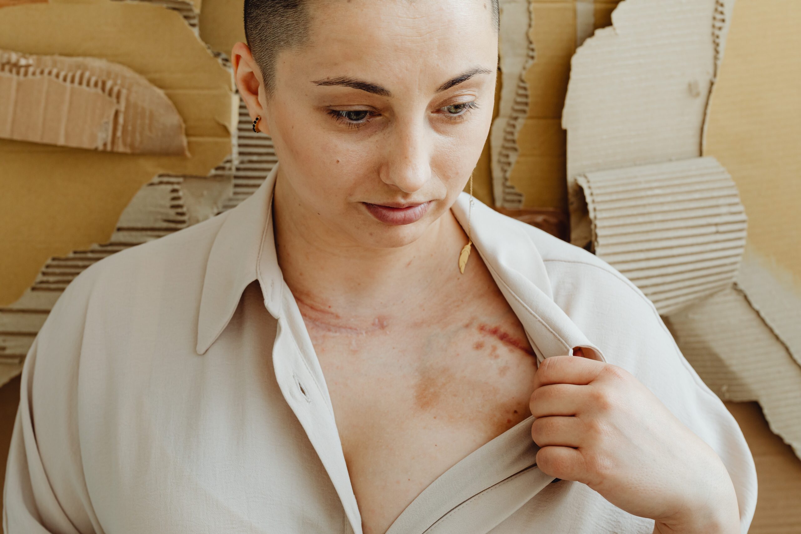 a woman showing a scar